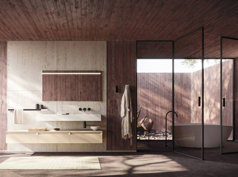 Salle de bain moderne avec meuble suspendu et baignoire ilot chez Showroom443 à Nîmes